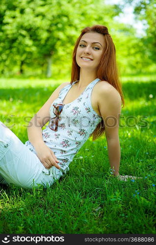 brunette on green grass