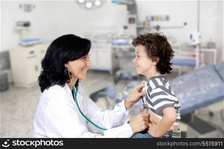 Brunette pediatrician at the hospital with a beautiful baby