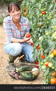 Brunette picking vegetables