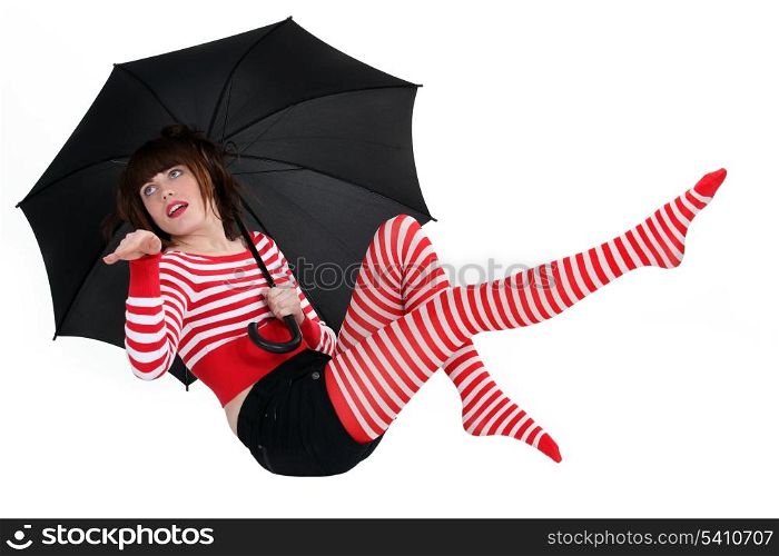 Brunette posing with umbrella