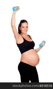 Brunette pregnant woman training with dumbbells isolated on a white background