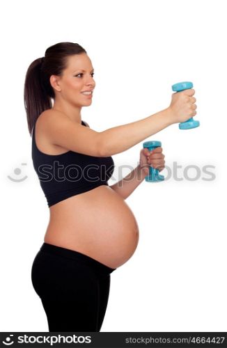 Brunette pregnant woman training with dumbbells isolated on a white background
