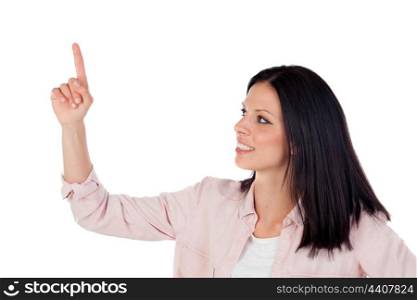 Brunette pretty girl indicating something with the finger isolated on a white background
