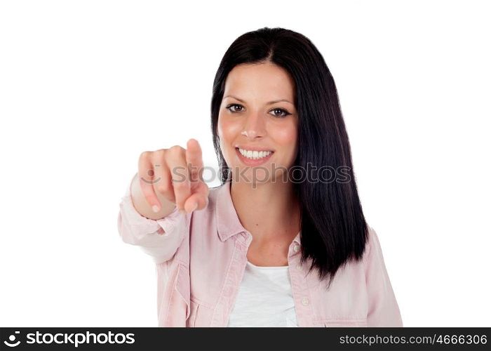 Brunette pretty girl pointing at camer with the finger isolated on a white background