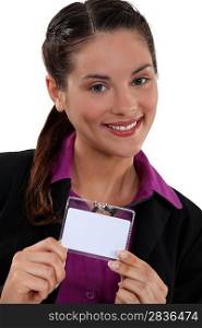 Brunette proudly displaying her business pass