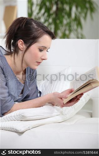 Brunette reading a book.