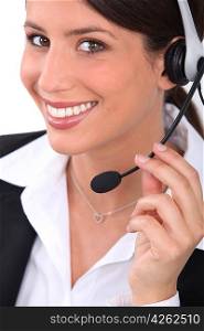 Brunette receptionist wearing head-set