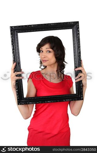 brunette red tunic holding frame