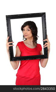 brunette red tunic holding frame