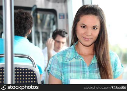 Brunette riding on tram
