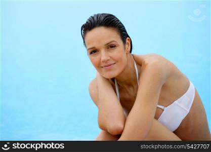 Brunette sat in white bikini