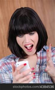brunette shouting angrily at phone