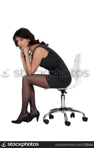 Brunette sitting on chair