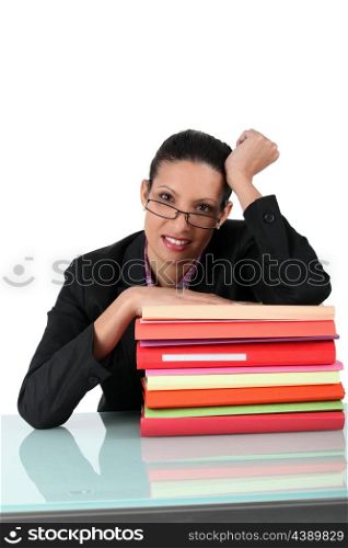 Brunette surrounded by paperwork