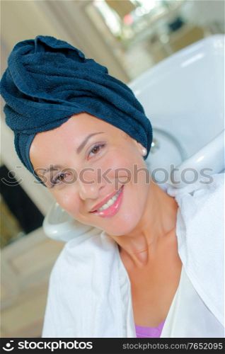 Brunette towel drying her hair
