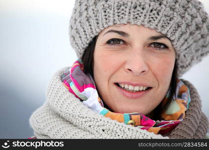 Brunette wearing hat and scarf