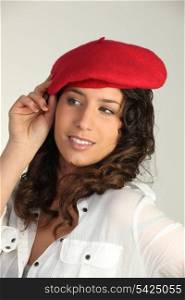Brunette wearing red beret