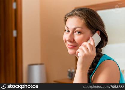 brunette with a radio telephone handset in the room