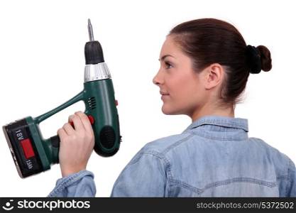 brunette with a wireless drill