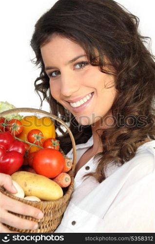 brunette with basket of vegetables