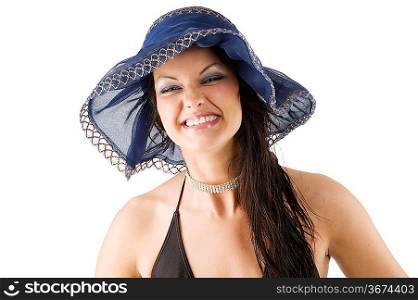 brunette with blue hat making funny face and showing her dental brace