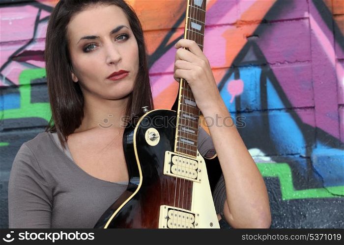 Brunette with electric guitar