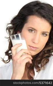 Brunette with glass of milk