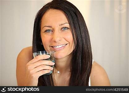 Brunette with glass of water