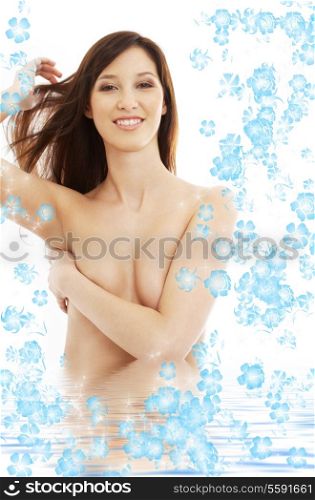 brunette with long hair standing in water with blowers