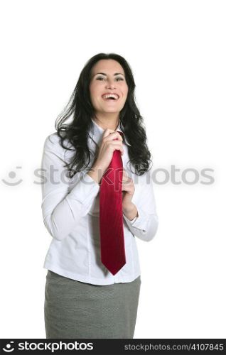 Brunette woman adjusting her necktie businesswoman isolated on white