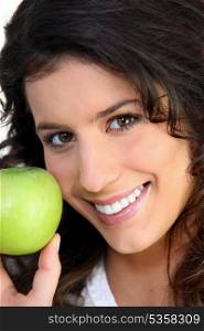Brunette woman and an apple
