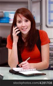 Brunette woman answering the phone