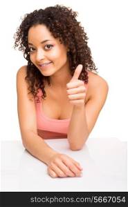 Brunette woman doing thumbs up while smiling