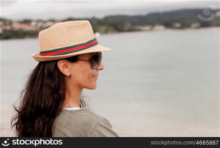 Brunette woman enjoying holidays in the Galician coast