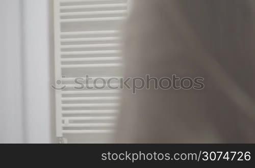 brunette woman in bathroom before shower wearing lingerie