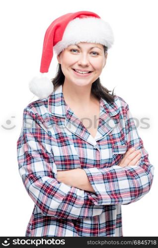 Brunette woman in pajama and red christmas cap on white backgrou. Brunette woman in pajama and red christmas cap on white background
