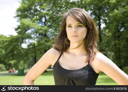 Brunette Woman In The Summer Park