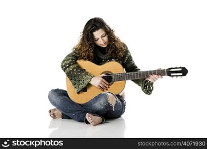 Brunette woman playing acoustic guitar