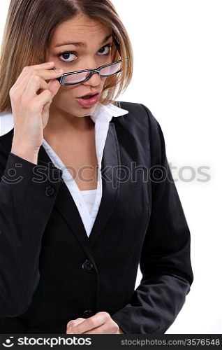 Brunette woman taking off her glasses