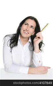 Brunette woman thinking with pencil isolated on white