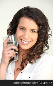 Brunette woman with glass of water