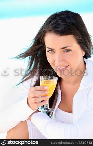 Brunette woman with orange juice