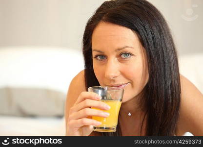 Brunette woman with orange juice