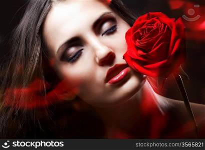 brunette woman with red rose