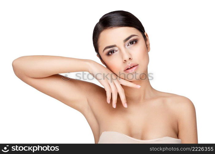 Brunette young woman with beautiful clean skin isoilated on white. Young brunette woman with beautiful clean skin