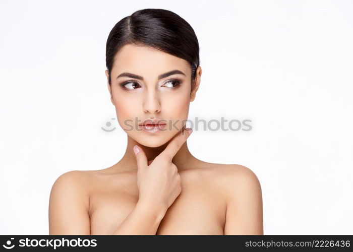 Brunette young woman with beautiful clean skin isoilated on white. Young brunette woman with beautiful clean skin