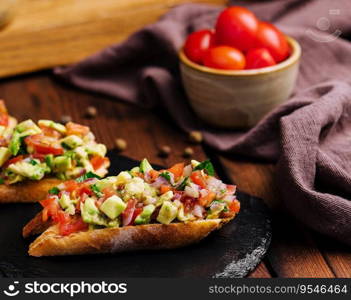 Bruschetta with avocado and tomato closeup