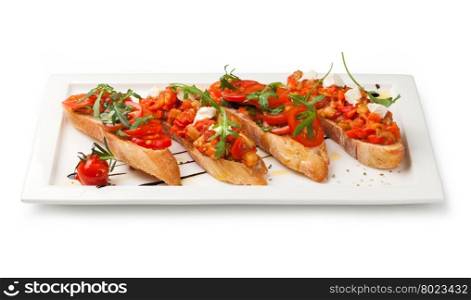 bruschettas. Italian Bruschetta Appetizer on the white plate