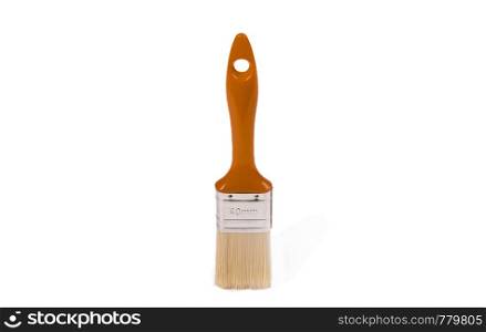 brush with orange plastic handle on a white background, top view
