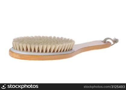 brush with wooden handle lies on table